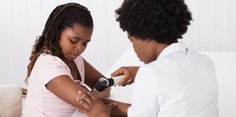 Doctor Examining Child